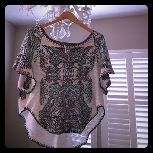 Hip poncho style sweater